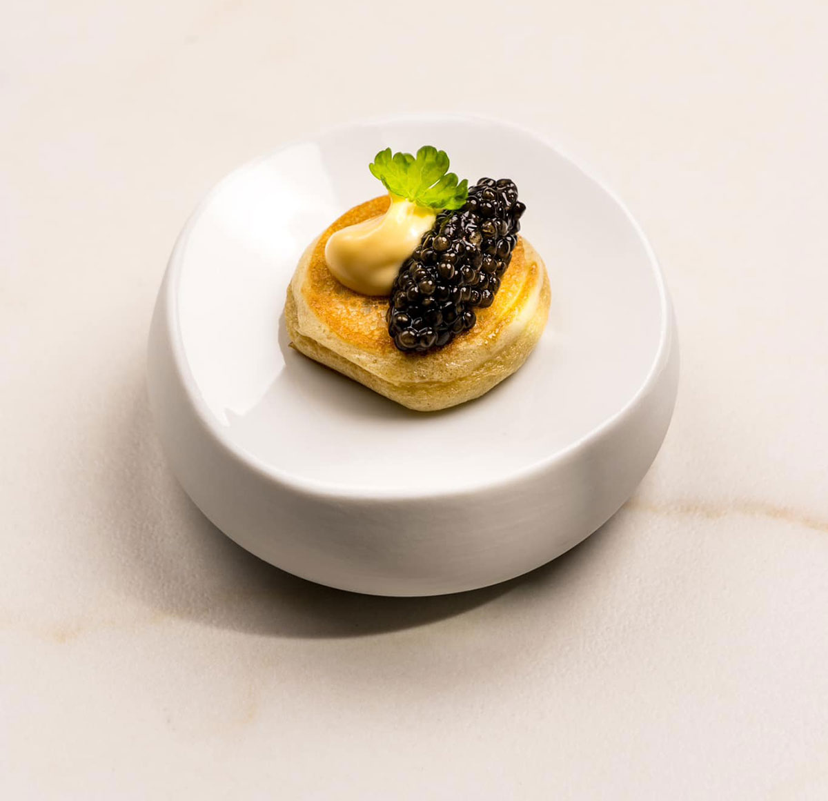 Anchoa, queso y caviar